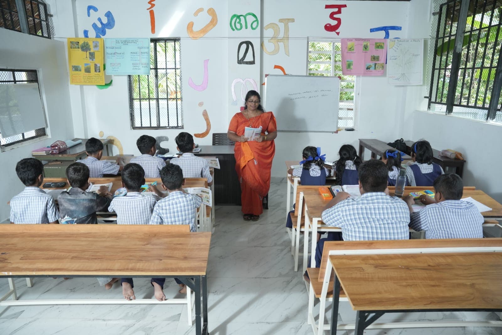 Teacher with students in a Union UP School classroom